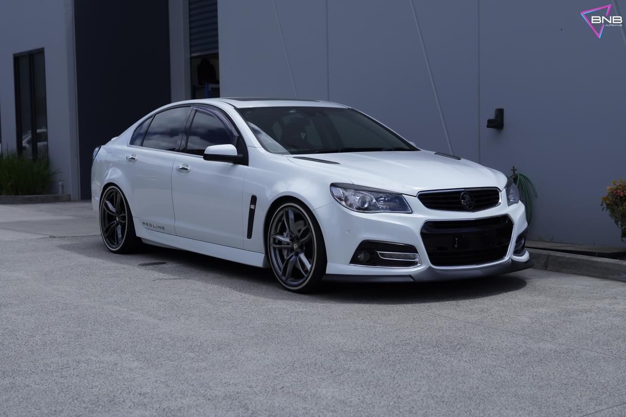 White Holden Commodore VF Redline on gunmetal split-spoke wheels