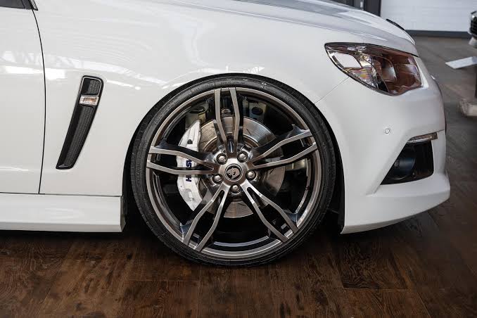 White Holden Commodore VF fitted with staggered bronze HSV alloy wheels